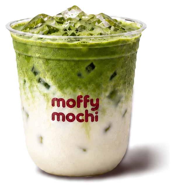 Iced ceremonial matcha latte, green matcha over cold milk and ice